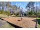 Community playground with swings, monkey bars and wood chip ground cover at 6012 Drave Ln, Fort Mill, SC 29715