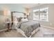 Spacious bedroom with a queen bed and calming color palette at 1983 Copper Path Dr, Fort Mill, SC 29715
