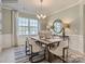 Elegant dining room with wood table, chandelier, and decorative accents at 1983 Copper Path Dr, Fort Mill, SC 29715