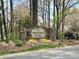 Stone Waterford Point community sign surrounded by manicured landscaping and mature trees at 21315 Blakely Shores Dr, Cornelius, NC 28031