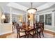 Spacious dining room open to living area, featuring a detailed trim package at 21315 Blakely Shores Dr, Cornelius, NC 28031