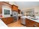 Spacious kitchen with stainless steel appliances, granite countertops, and wood cabinets at 21315 Blakely Shores Dr, Cornelius, NC 28031