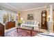 Cozy living room featuring large windows, plantation shutters, and elegant furnishings at 21315 Blakely Shores Dr, Cornelius, NC 28031