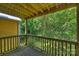 Balcony view with wooden railing overlooking lush greenery at 3302 Selwyn Farms Ln, Charlotte, NC 28209