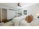 Light and airy bedroom featuring hardwood floors, a window, and overhead fan at 3302 Selwyn Farms Ln, Charlotte, NC 28209