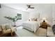 Relaxing bedroom with neutral tones, a ceiling fan, and natural light at 3302 Selwyn Farms Ln, Charlotte, NC 28209
