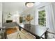 Open dining area with hardwood floors looking into the living room at 3302 Selwyn Farms Ln, Charlotte, NC 28209