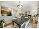 Open concept dining area with hardwood floors, open to the kitchen and living room at 3302 Selwyn Farms Ln, Charlotte, NC 28209