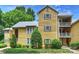 Charming yellow condo with multiple balconies and lush landscaping at 3302 Selwyn Farms Ln, Charlotte, NC 28209