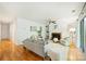 Comfortable living room featuring a fireplace, built-in shelving, and a sliding glass door at 3302 Selwyn Farms Ln, Charlotte, NC 28209