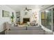 Bright living room with hardwood floors, fireplace, built-ins, and sliding door to balcony at 3302 Selwyn Farms Ln, Charlotte, NC 28209