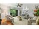 Open concept living room with sliding doors to balcony and hardwood floors at 3302 Selwyn Farms Ln, Charlotte, NC 28209