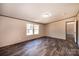 Bright bedroom featuring hardwood floors, light walls and trim, and a double window overlooking the front yard at 3365 34Th Avenue Ne Ct, Hickory, NC 28601