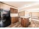 Bright kitchen featuring wooden cabinetry, stainless steel appliances, and an island with light countertops at 3365 34Th Avenue Ne Ct, Hickory, NC 28601