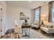 Bright office space with wood desk, two armchairs, and large art piece at 4064 Skyboat Cir, Fort Mill, SC 29715