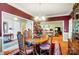 Bright dining room with hardwood floors and view into living room at 8420 Locksley Dr, Harrisburg, NC 28075