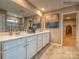 Elegant bathroom with double vanity and walk-in shower at 123 Dogwood Grove Pl, Troutman, NC 28166