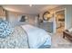 Bright bedroom featuring a king-size bed and ensuite bathroom at 123 Dogwood Grove Pl, Troutman, NC 28166