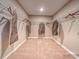 Spacious walk-in closet with garment bags at 123 Dogwood Grove Pl, Troutman, NC 28166