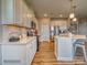 White shaker kitchen cabinets, quartz countertops, and stainless steel appliances at 123 Dogwood Grove Pl, Troutman, NC 28166