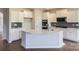 Modern kitchen featuring island and white cabinets at 123 Dogwood Grove Pl, Troutman, NC 28166