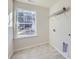 Laundry room with window and shelving at 123 Dogwood Grove Pl, Troutman, NC 28166