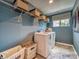 Laundry room with shelving, a washer, and dryer, plus good natural light at 123 Dogwood Grove Pl, Troutman, NC 28166