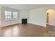 Bright living room with fireplace and hardwood floors at 123 Dogwood Grove Pl, Troutman, NC 28166