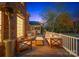 Evening view of backyard patio with seating area and pool in background at 1511 Churchill Downs Dr, Waxhaw, NC 28173