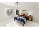 Bright bedroom with a metal bed frame and window coverings at 1511 Churchill Downs Dr, Waxhaw, NC 28173