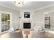 Cozy Gathering room featuring a fireplace and built-in shelving at 1511 Churchill Downs Dr, Waxhaw, NC 28173