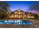 Luxury pool with spa and brick patio, perfect for entertaining at 1511 Churchill Downs Dr, Waxhaw, NC 28173