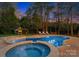 Relaxing pool and spa area with lounge chairs in backyard at 1511 Churchill Downs Dr, Waxhaw, NC 28173