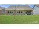 Green backyard featuring a screened-in porch that provides shade from the sun at 1578 Croydon St, Indian Land, SC 29707