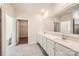Luxurious bathroom with double vanity, large mirror, and a separate walk-in closet at 1578 Croydon St, Indian Land, SC 29707