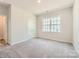 Comfortable bedroom with neutral carpet and a large window for natural light at 1578 Croydon St, Indian Land, SC 29707