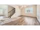 Elegant dining room with hardwood floors, wainscoting, and large windows at 1578 Croydon St, Indian Land, SC 29707