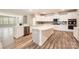 Modern kitchen with white cabinets, stainless steel appliances, and a spacious island at 1578 Croydon St, Indian Land, SC 29707