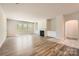 Bright and airy living room featuring hardwood floors and a cozy fireplace at 1578 Croydon St, Indian Land, SC 29707