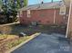 Backyard with AC unit and partial view of house at 323 Breslin St, Wadesboro, NC 28170