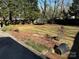 Large backyard with trampoline and trees at 323 Breslin St, Wadesboro, NC 28170