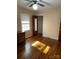 Bedroom with hardwood floors, ceiling fan and mirrored closet at 323 Breslin St, Wadesboro, NC 28170