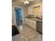 Kitchen with view into dining room, white cabinets, and gray countertops at 323 Breslin St, Wadesboro, NC 28170