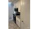 Stainless steel appliances and white cabinets in this galley kitchen at 323 Breslin St, Wadesboro, NC 28170