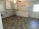 Laundry room with tile flooring, cabinets, and exterior access at 323 Breslin St, Wadesboro, NC 28170