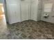 Laundry room with tile flooring, built-in cabinets, and sink at 323 Breslin St, Wadesboro, NC 28170