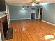 Living room with hardwood floors, fireplace, and built-ins at 323 Breslin St, Wadesboro, NC 28170