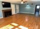 Living room with hardwood floors, fireplace, and built-ins at 323 Breslin St, Wadesboro, NC 28170