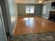 Spacious living room with hardwood floors and fireplace at 323 Breslin St, Wadesboro, NC 28170