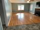 Spacious living room with hardwood floors and fireplace at 323 Breslin St, Wadesboro, NC 28170